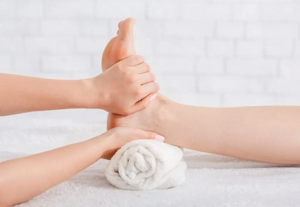 foot massage on white background